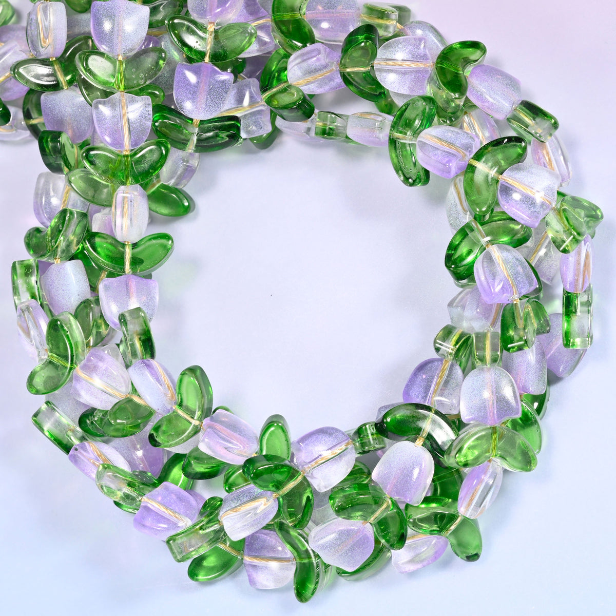 Lavender Tulip Flower glass beads with leaf, close view of the coiled strands in lavender flower buds alternating with green glass leaves
