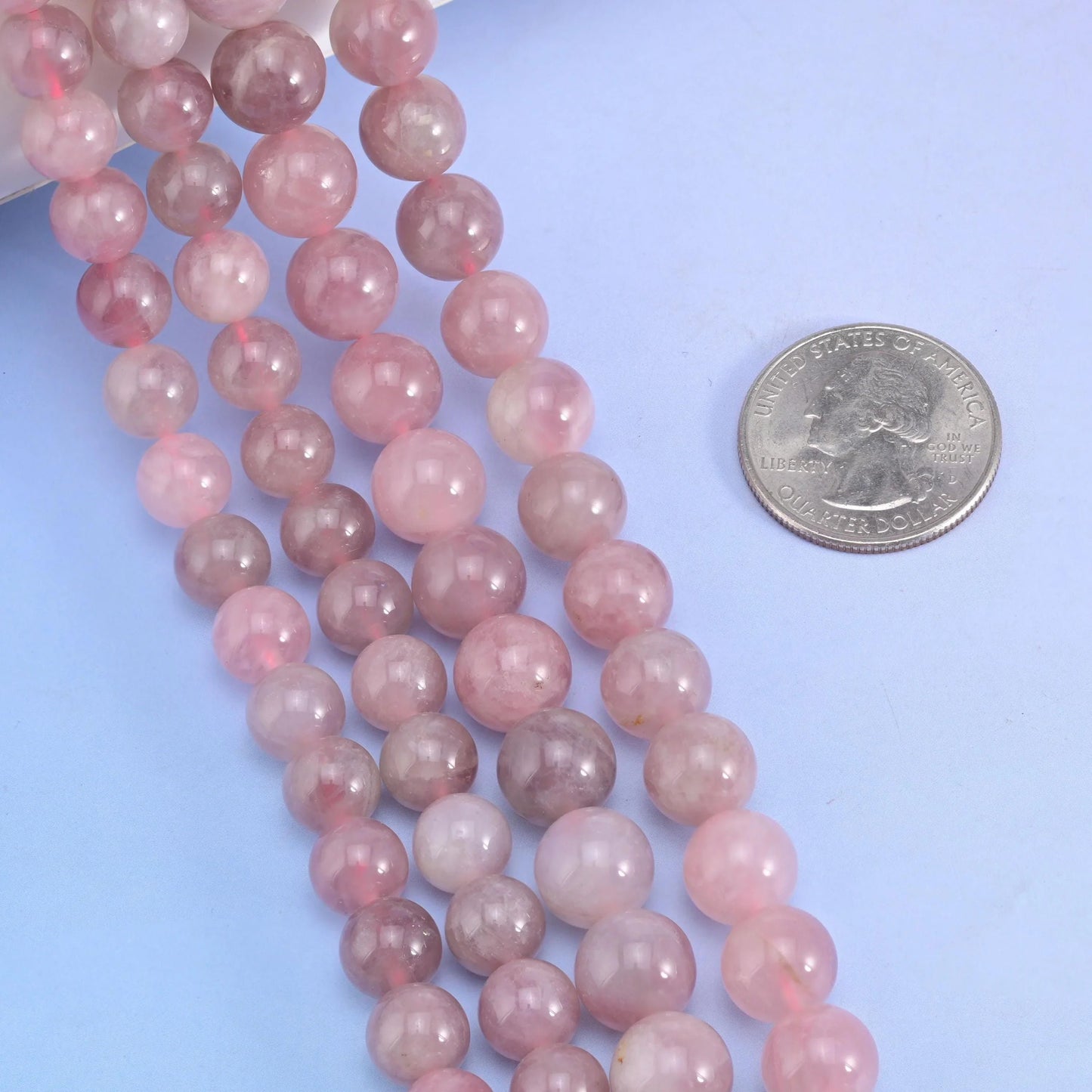 Smooth round cut Madagascar Rose Quartz beads for jewelry making.