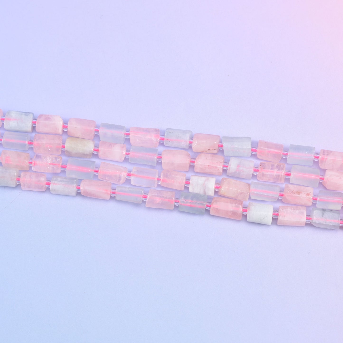 Multi-Color Morganite beads in soft pastel pink and blue hues.