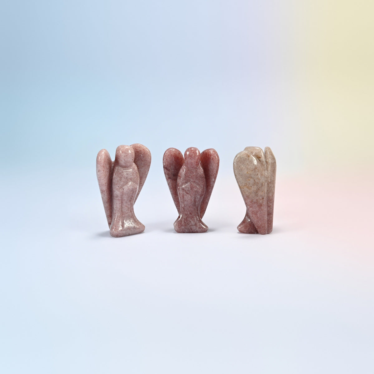 Three natural strawberry quartz guardian angel carvings, mauve pink with red flecks, 2 inch