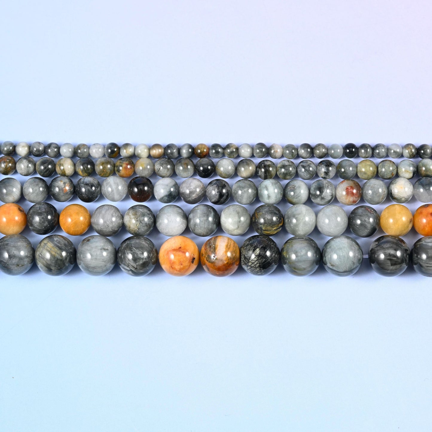 Eagle Eye Jasper Round Beads in silver-grey with black streaking and a cat's-eye sheen