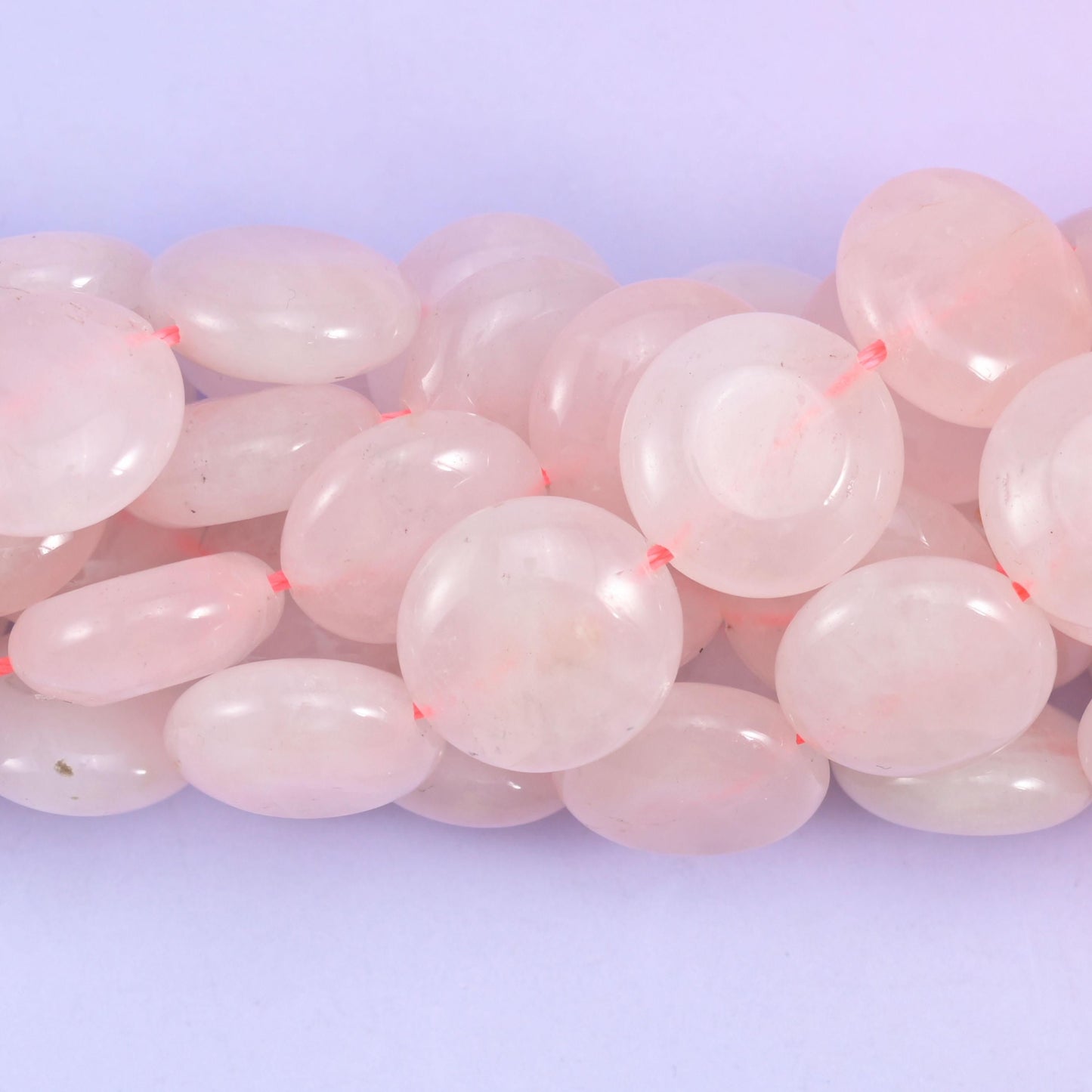Coin cut Rose Quartz beads with a glassy high polish