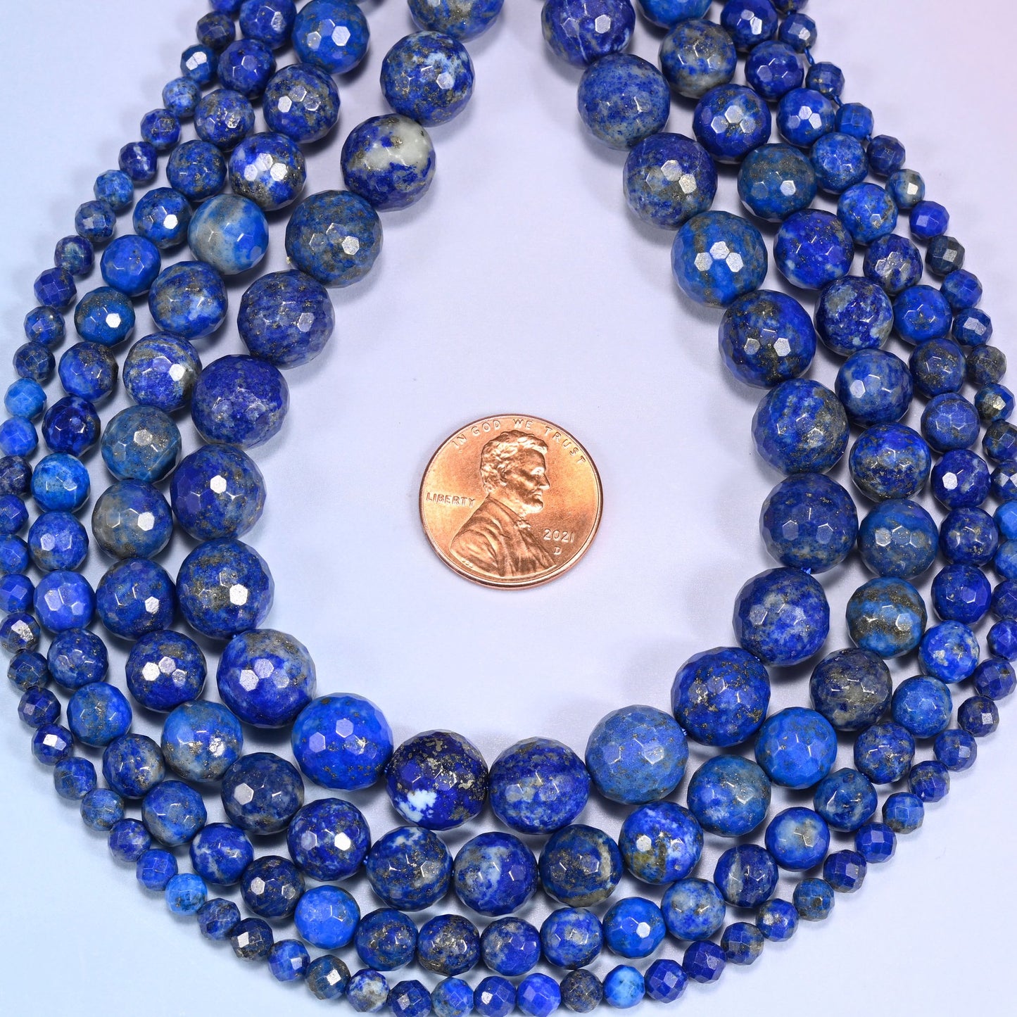 Lapis Lazuli Faceted Round Beads, approximately 86 beads at 4mm and 35 at 10mm per strand.