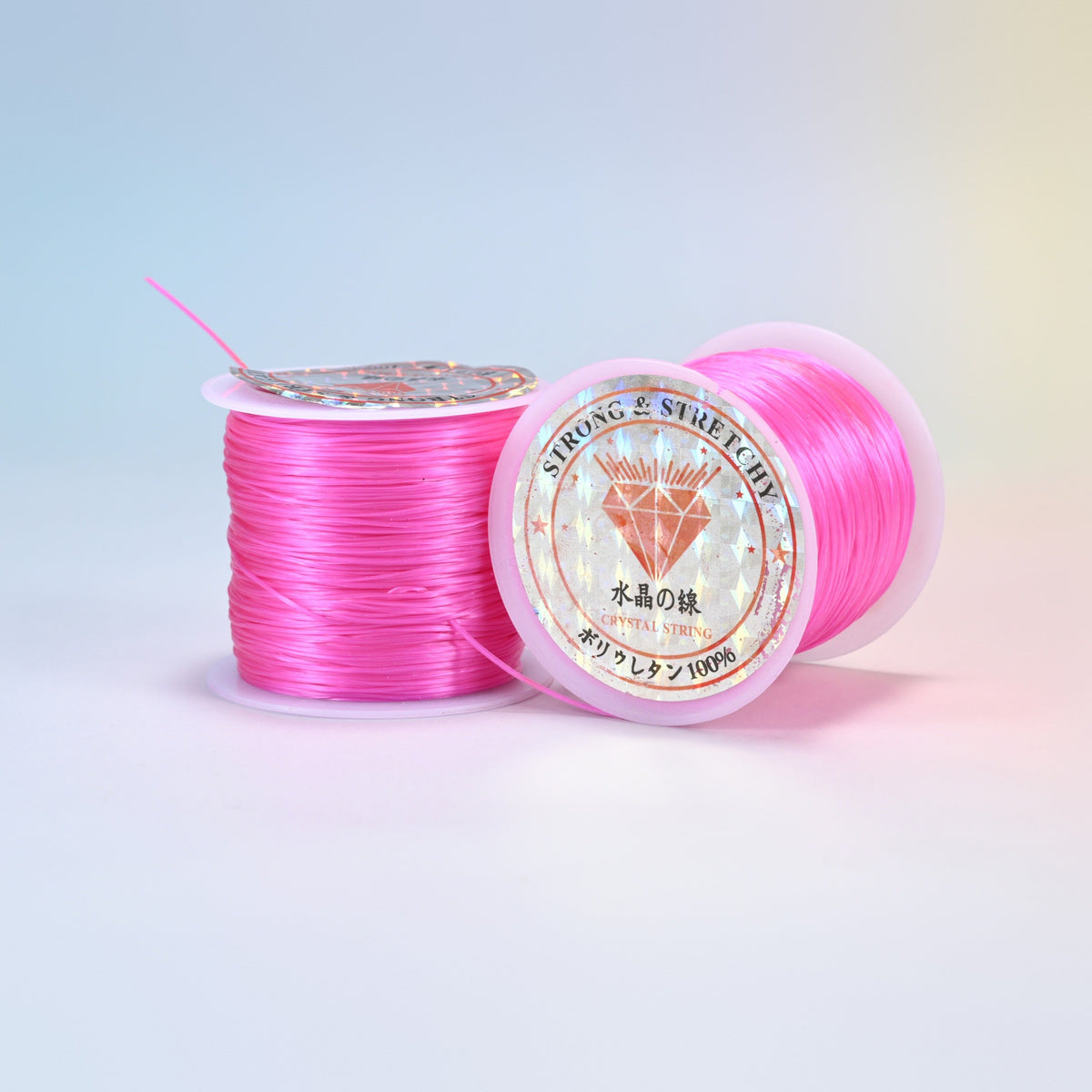 Two rolls of hot pink 0.7-0.8mm elastic stretch string, glossy polyurethane bead cord with a holographic label