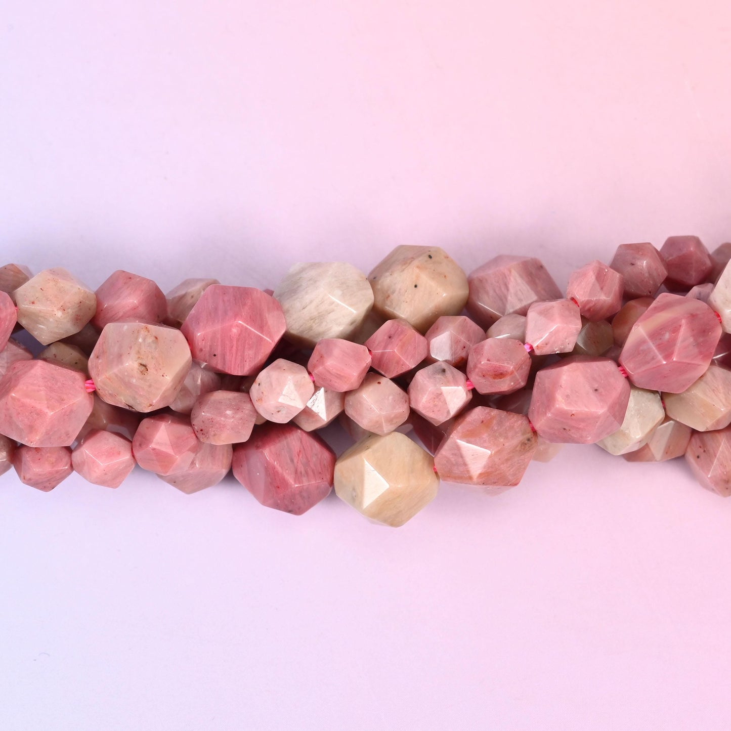 Dusty rose Pink Rhodonite stone mottled with oatmeal cream, cut into star facets