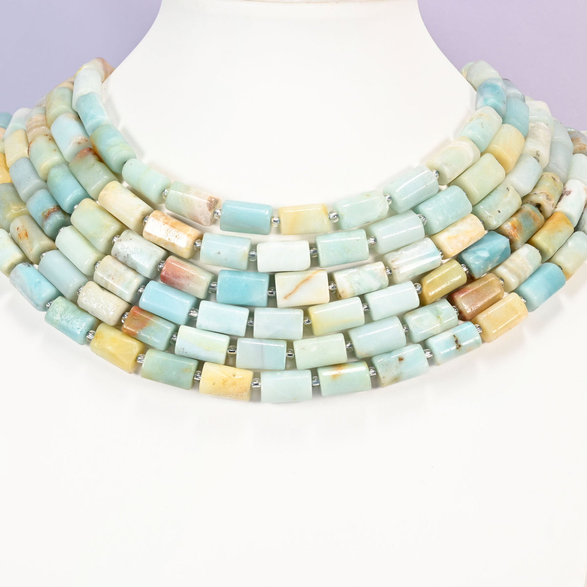 Multi-Color Amazonite faceted tube beads laid in four graduated collar rows, 12x8mm tubes in blue, green, cream and yellow