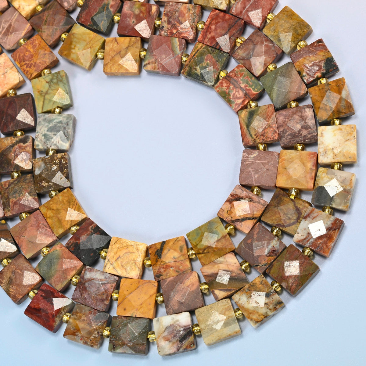 Natural red howlite faceted flat square beads curved into an open loop, brick red, olive green and charcoal beads