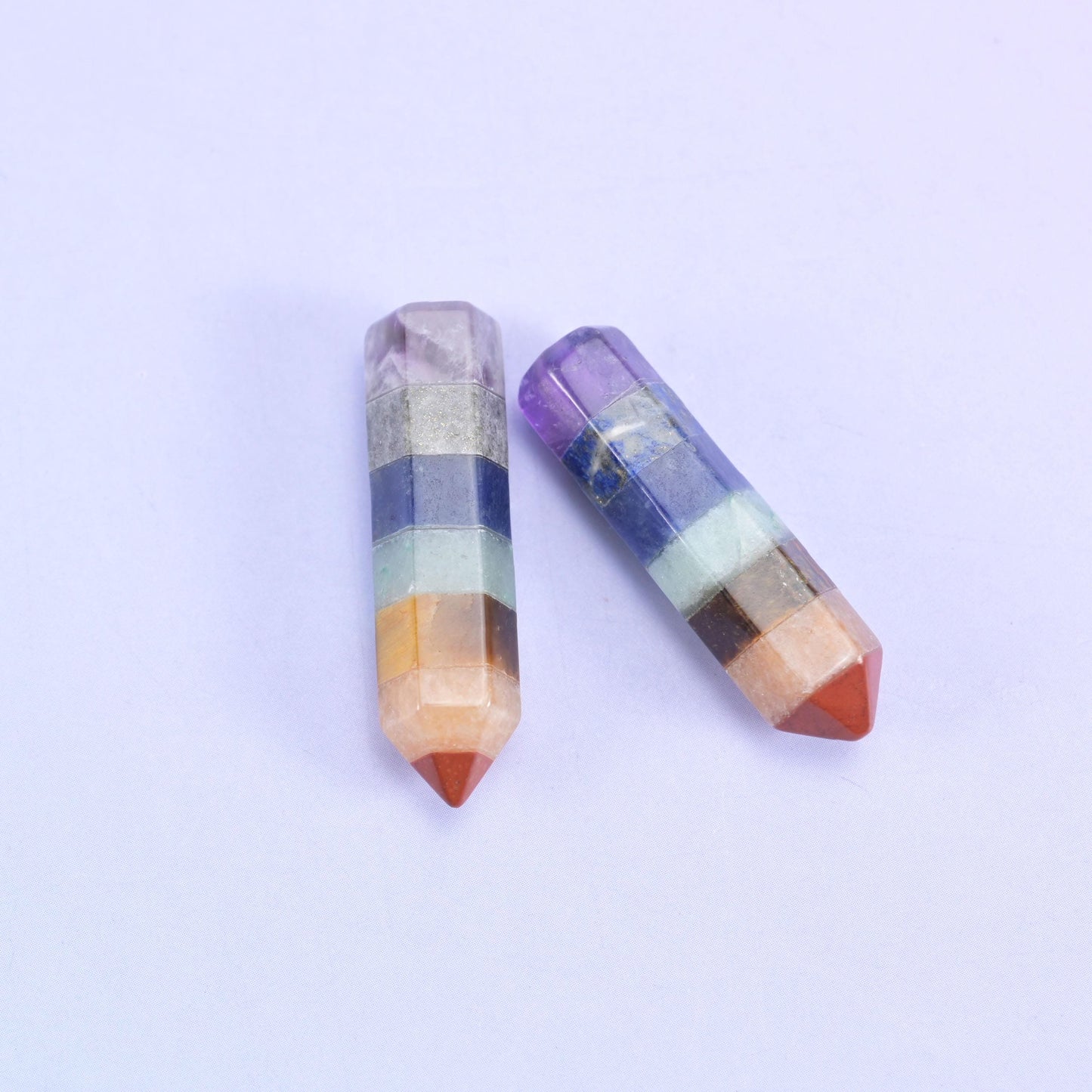 Two hexagon towers, one single point and one double terminated, banded in violet, cream and orange