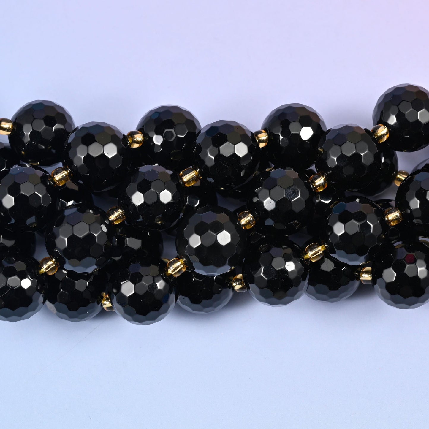 Faceted round cut black onyx beads