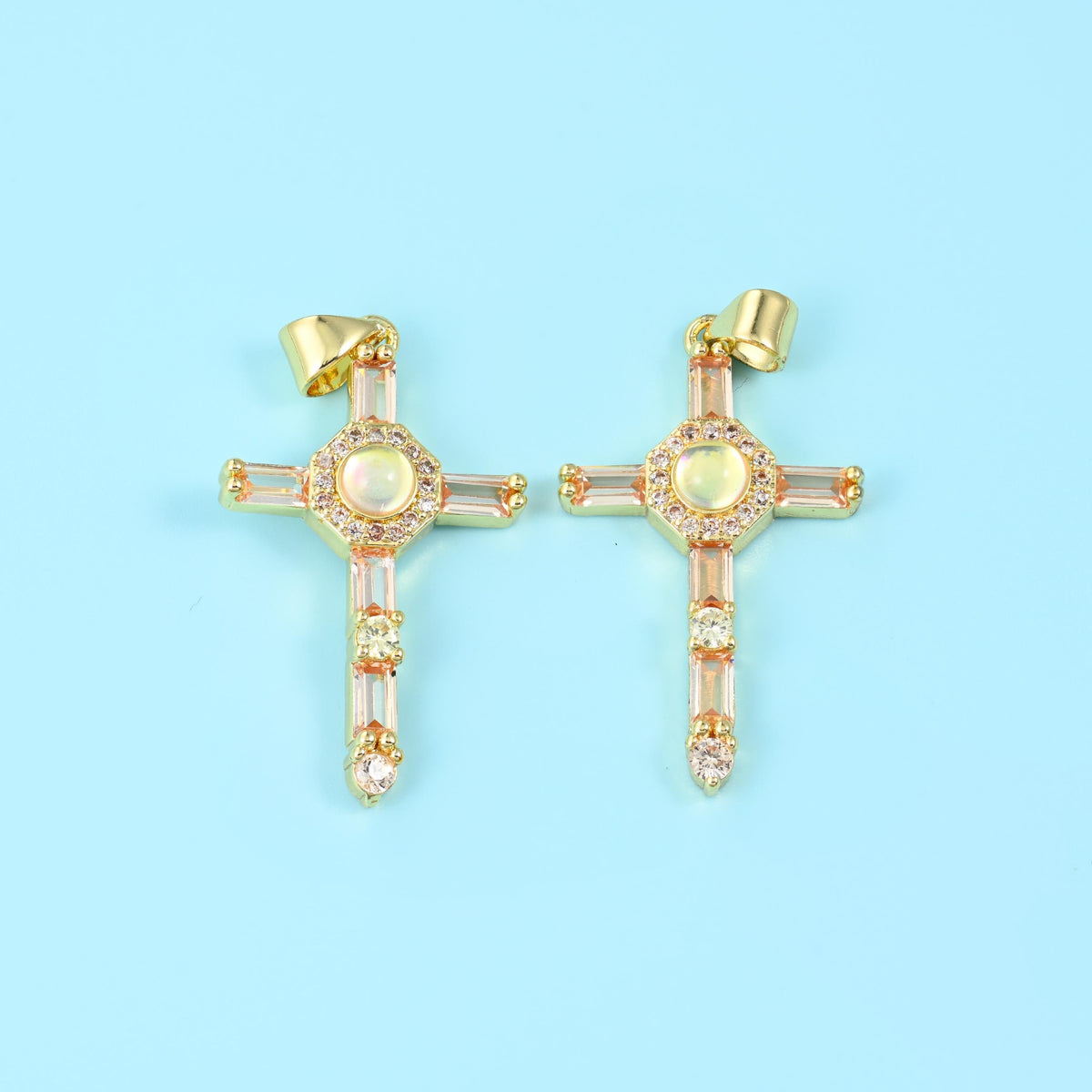 18K gold plated cross zirconia pendant in champagne peach, two crosses with pale warm-toned stones.