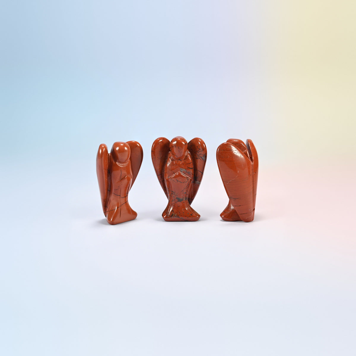 Three natural red jasper guardian angel carvings, brick red, 2 inch