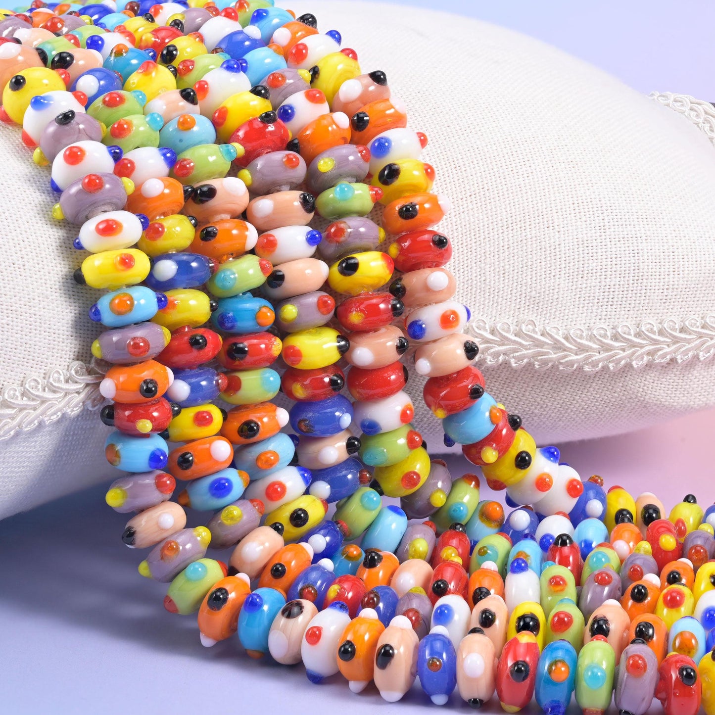 Multi-Color Dotted Donut Glass Beads in red, cobalt, orange, yellow and sky blue
