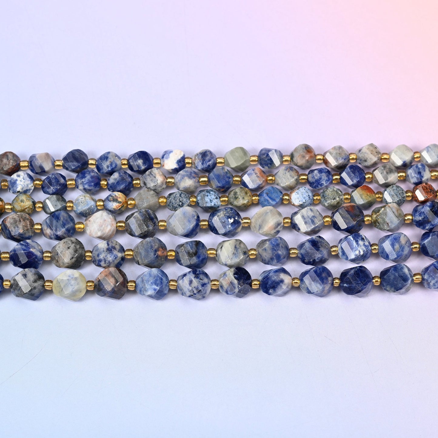 Orange Sodalite beads in deep denim and navy blue marbled with chalky white and rust
