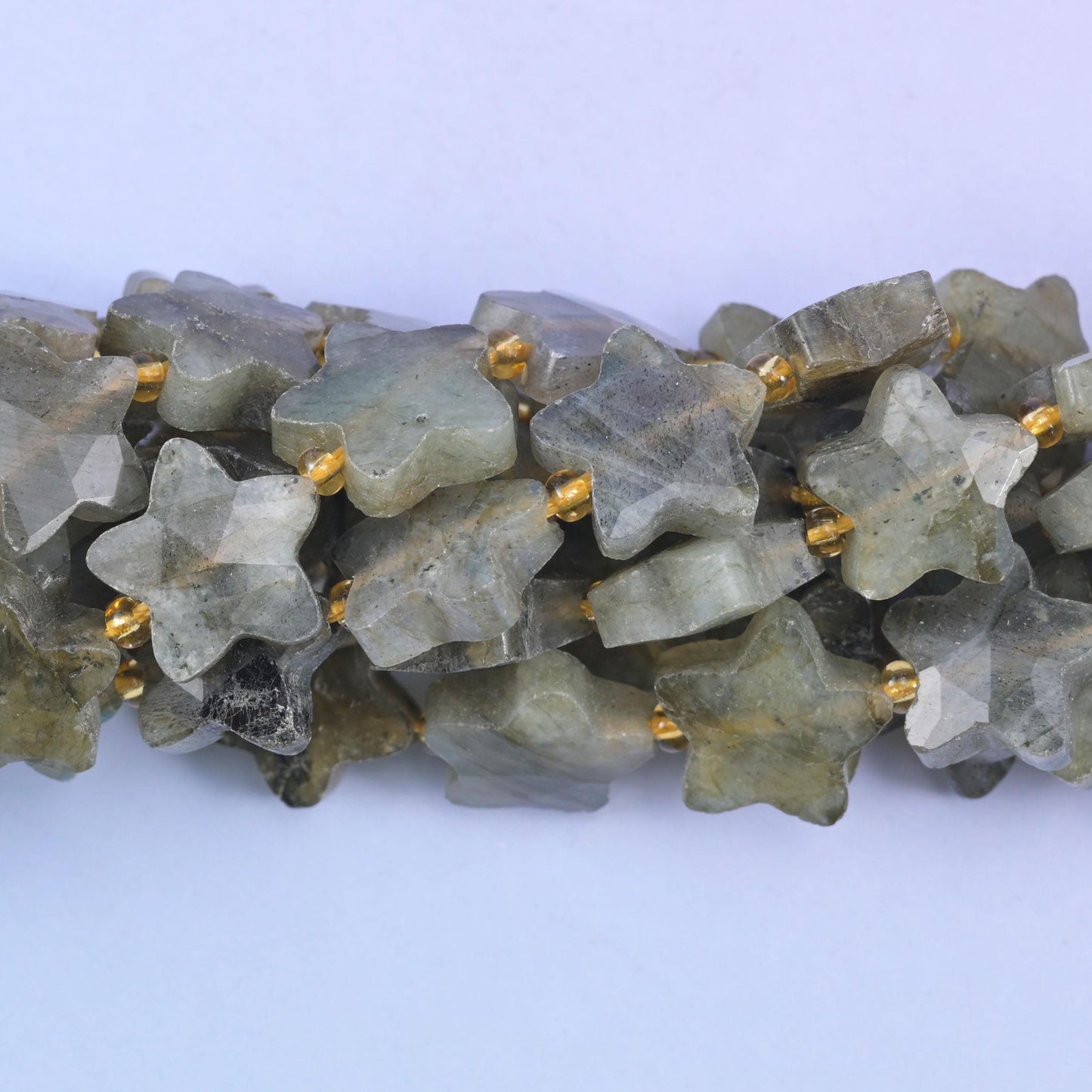 Faceted star cut gray labradorite beads