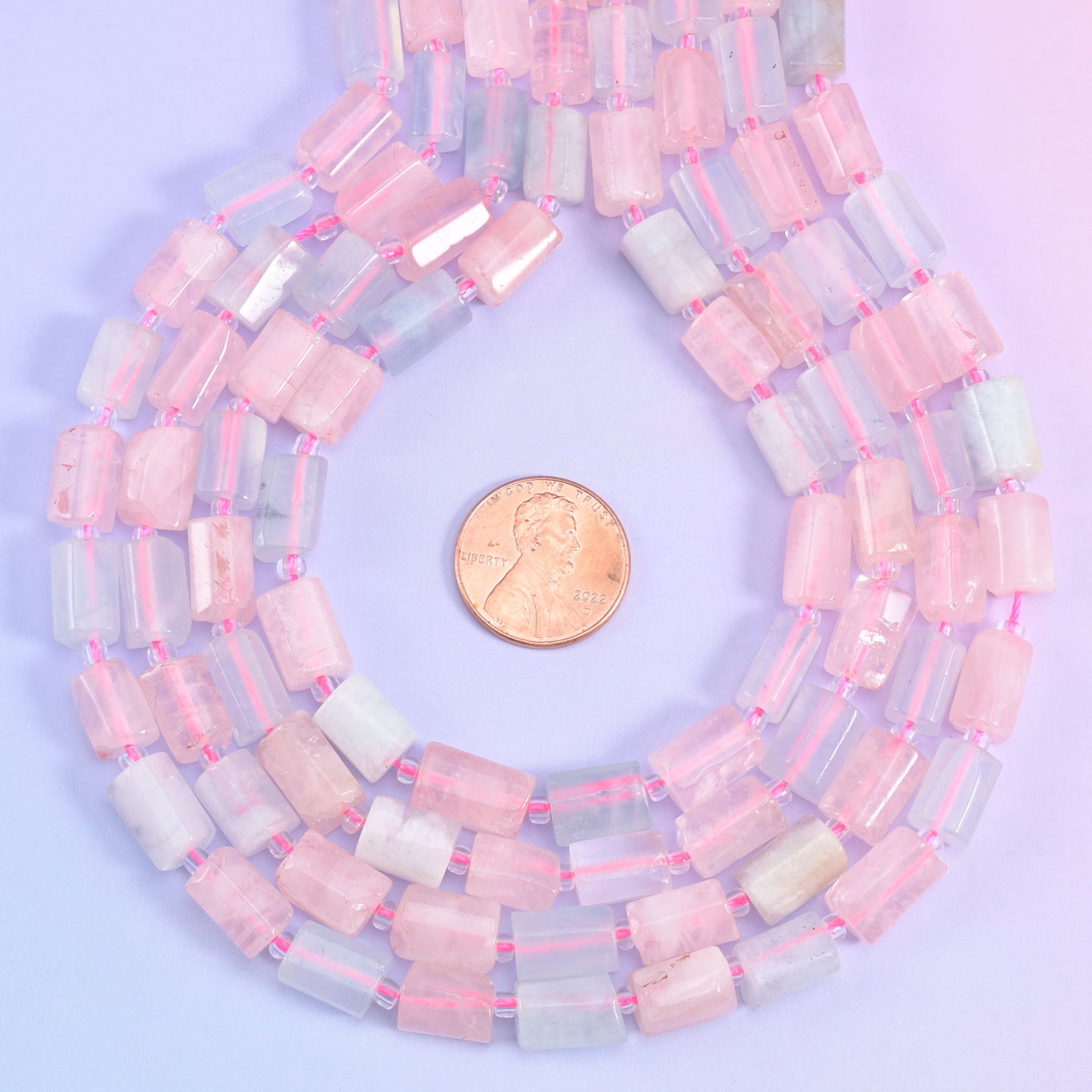 Natural Multi-Color Morganite faceted tube cylinder beads with delicate pastel pink and blue hues.