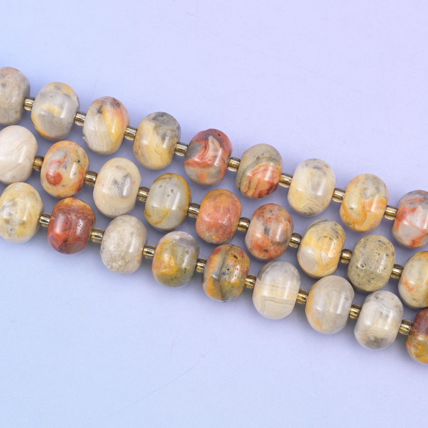 Crazy agate beads in warm cream, tan and terracotta swirl patterns