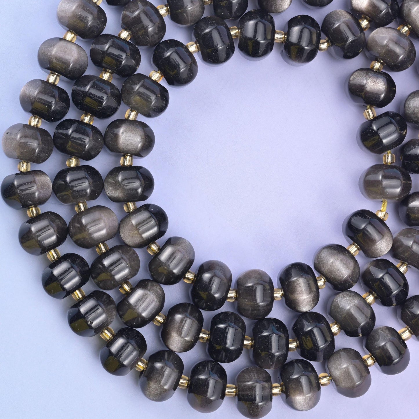 Silver obsidian pumpkin beads, approximately 35 beads per strand