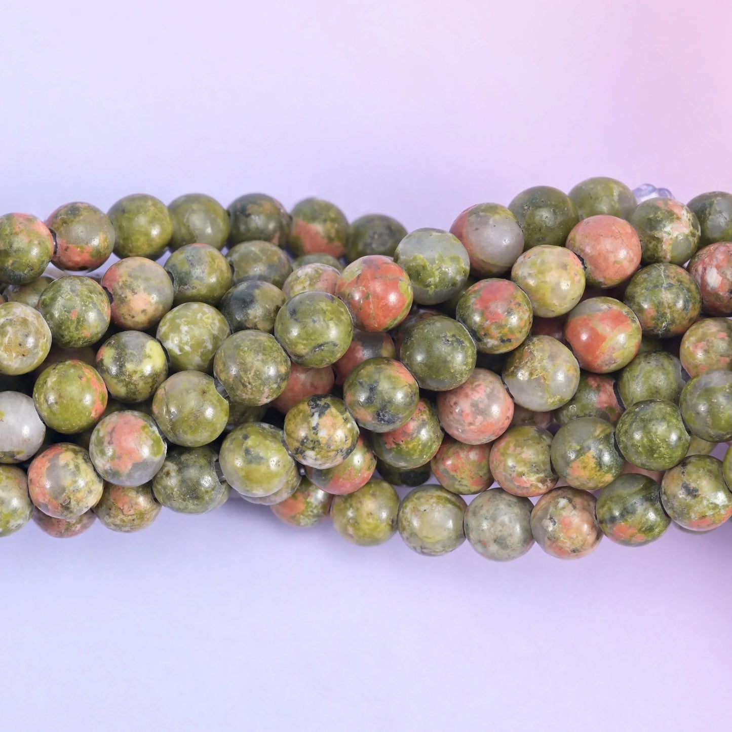 Smooth round cut unakite beads