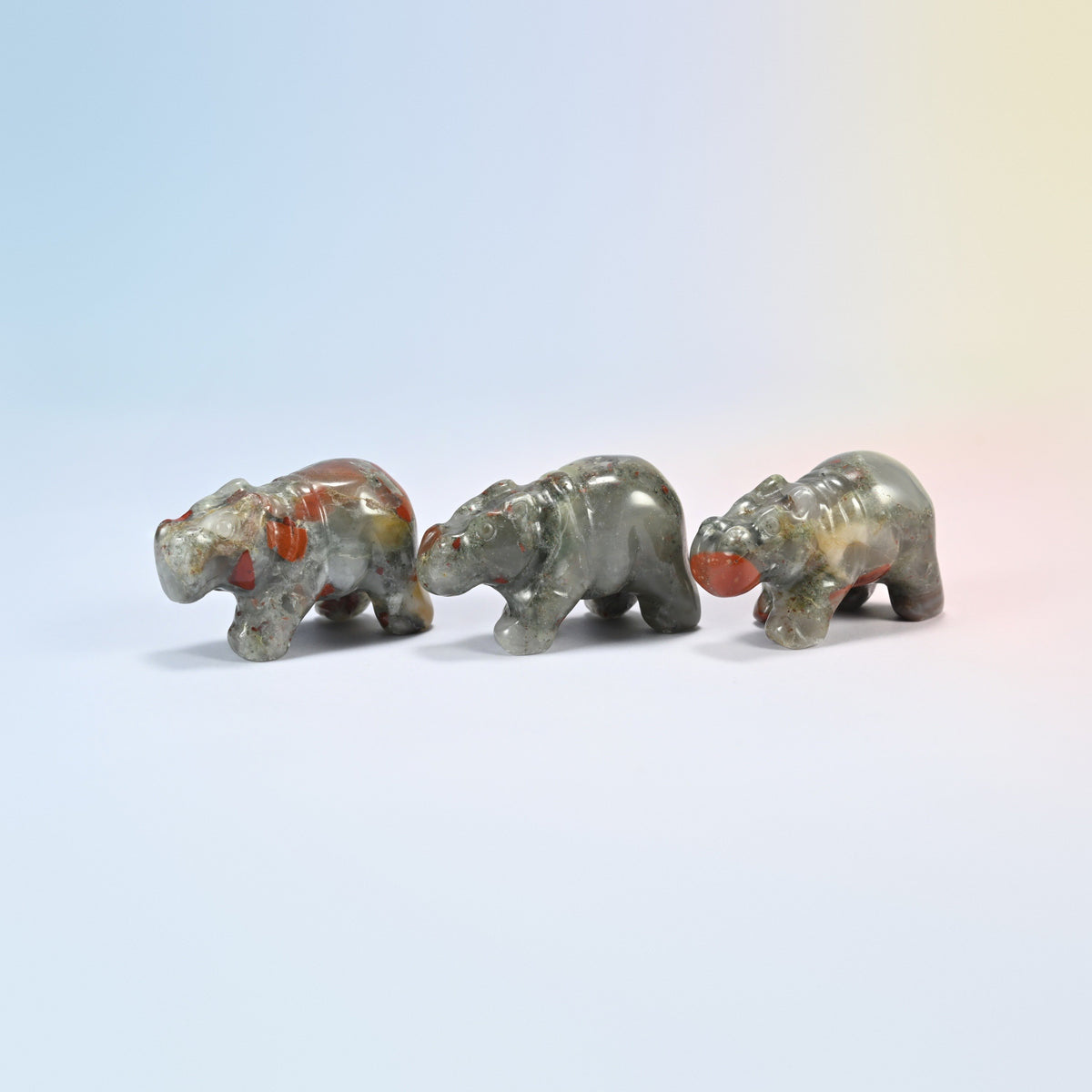 Three natural African bloodstone hippo crystal carvings, 2 inch, gray-green with red spots