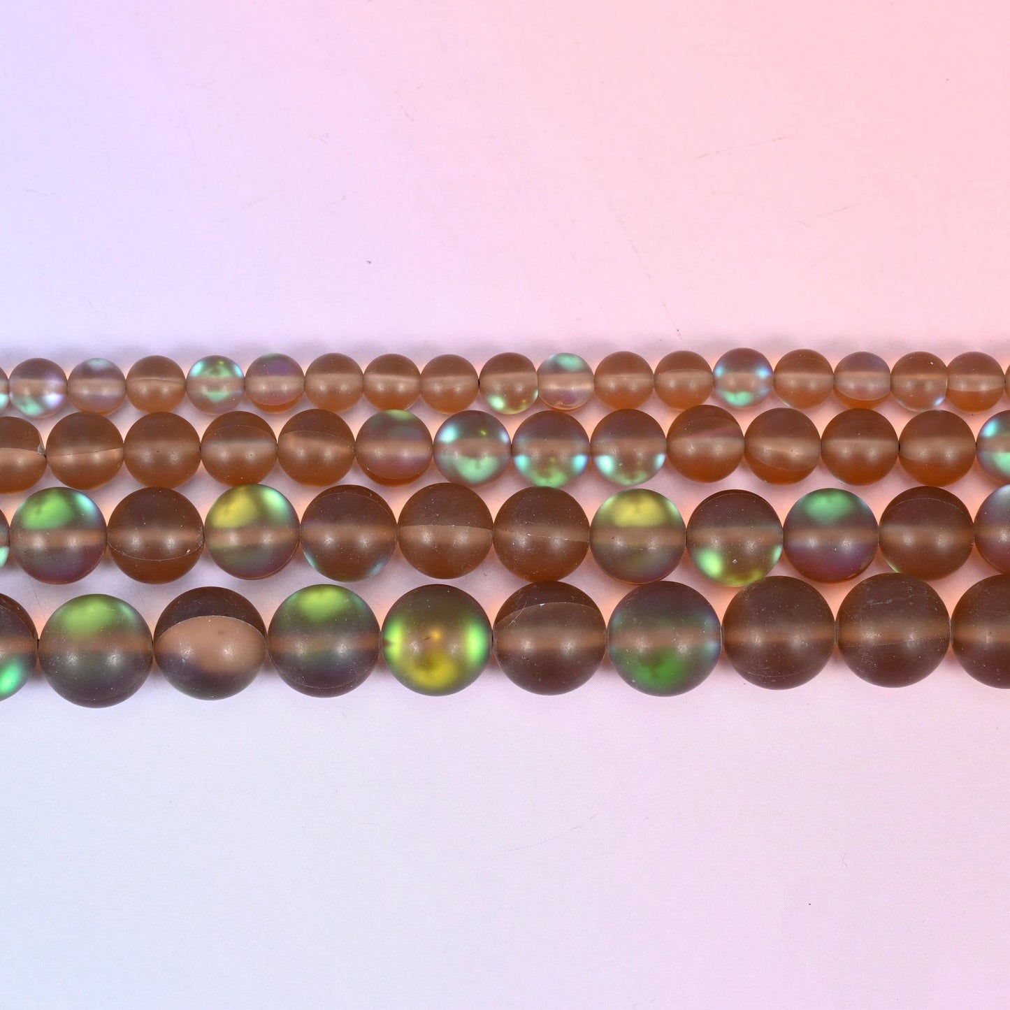 Mystic Aura Matte Brown Round Glass Beads in warm coffee-brown with a green and teal iridescent aurora