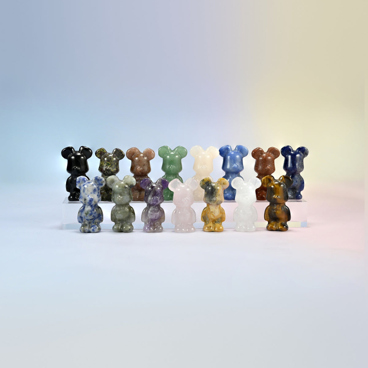 Group of 1.5 inch and 2 inch power bear crystal carvings in amethyst, green aventurine, blue aventurine, tiger eye, black obsidian, sodalite and more
