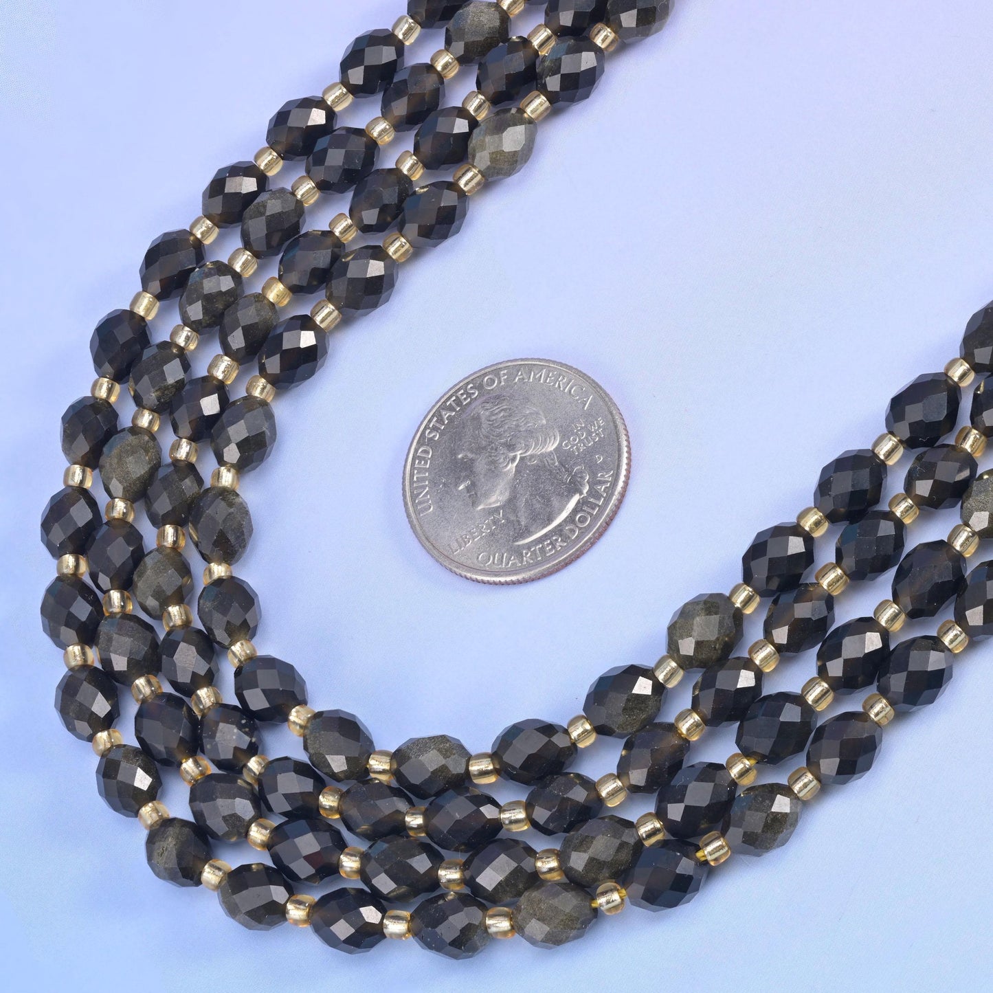 Gold Obsidian Faceted Rice Barrel Beads in near-black with a bronze-gold sheen