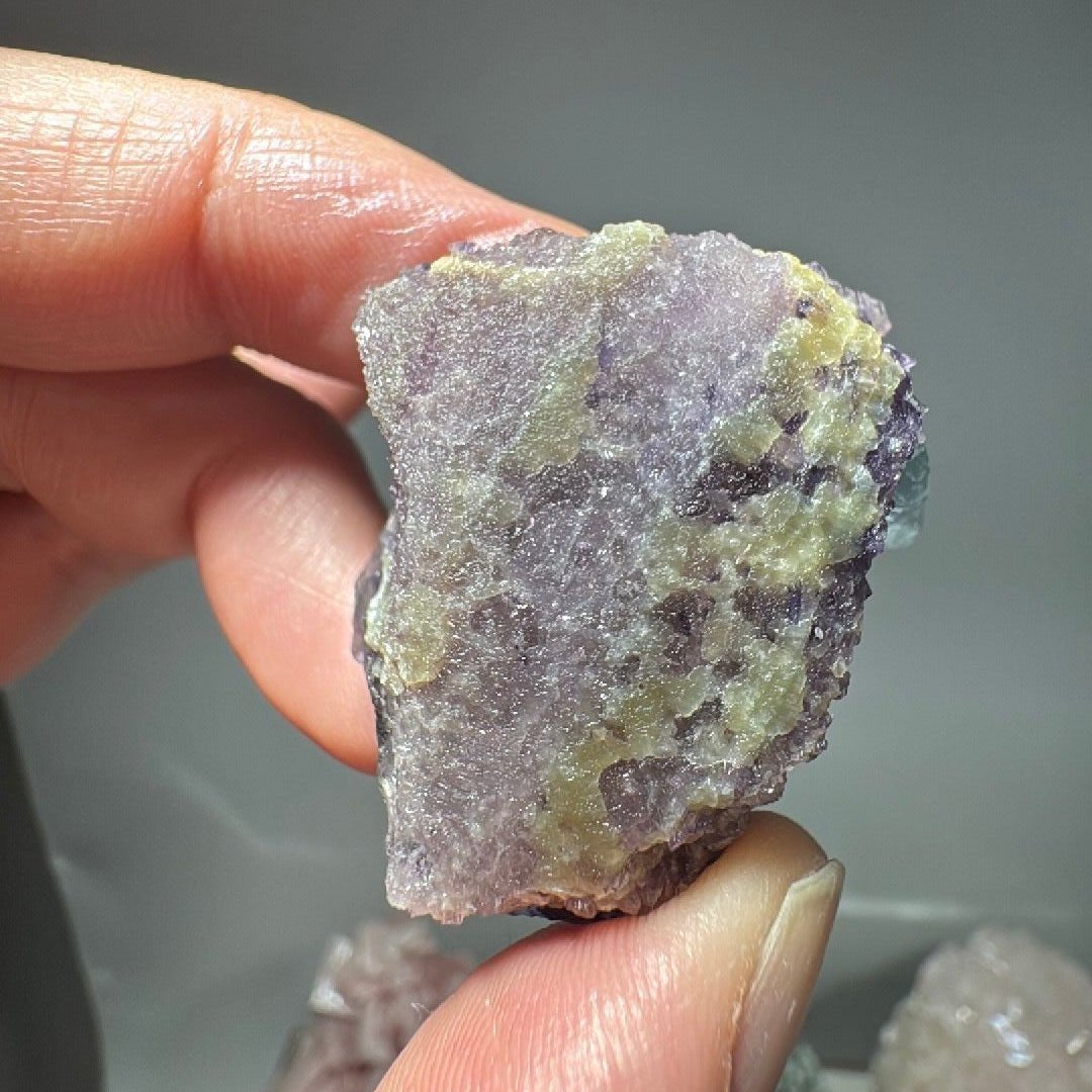 Reverse of the Fluorite specimen showing a crusty yellow-green calcite coating