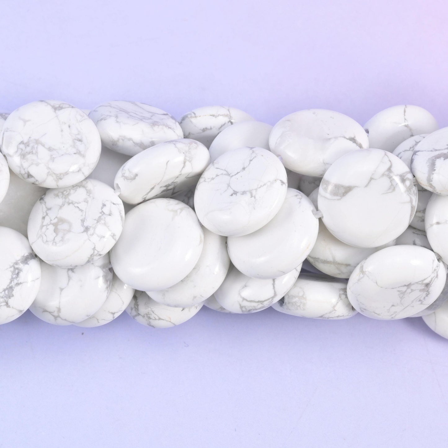 Coin cut White Howlite beads with a soft satin polish