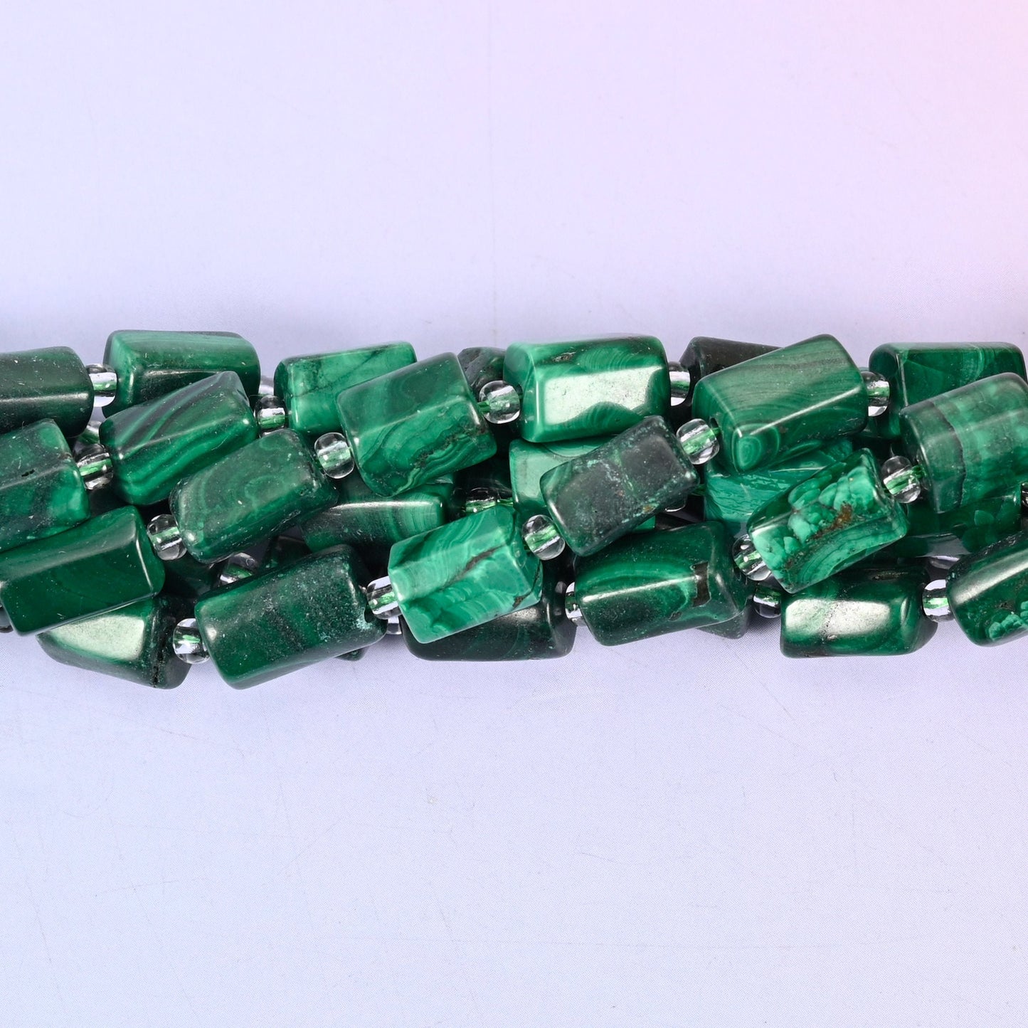 Natural Malachite faceted tube beads — a sleek, contemporary cylinder shape with rich green banding, perfect for handmade jewelry designs.