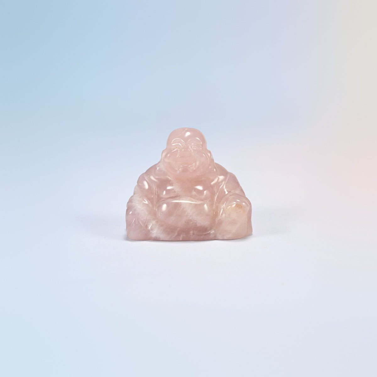 One rose quartz laughing Buddha crystal carving, light pink natural stone