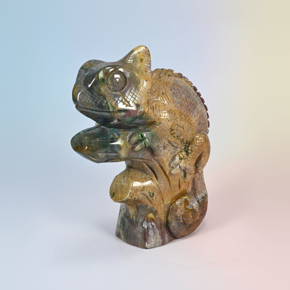 Front three-quarter view of the natural ocean jasper chameleon with green spotted head