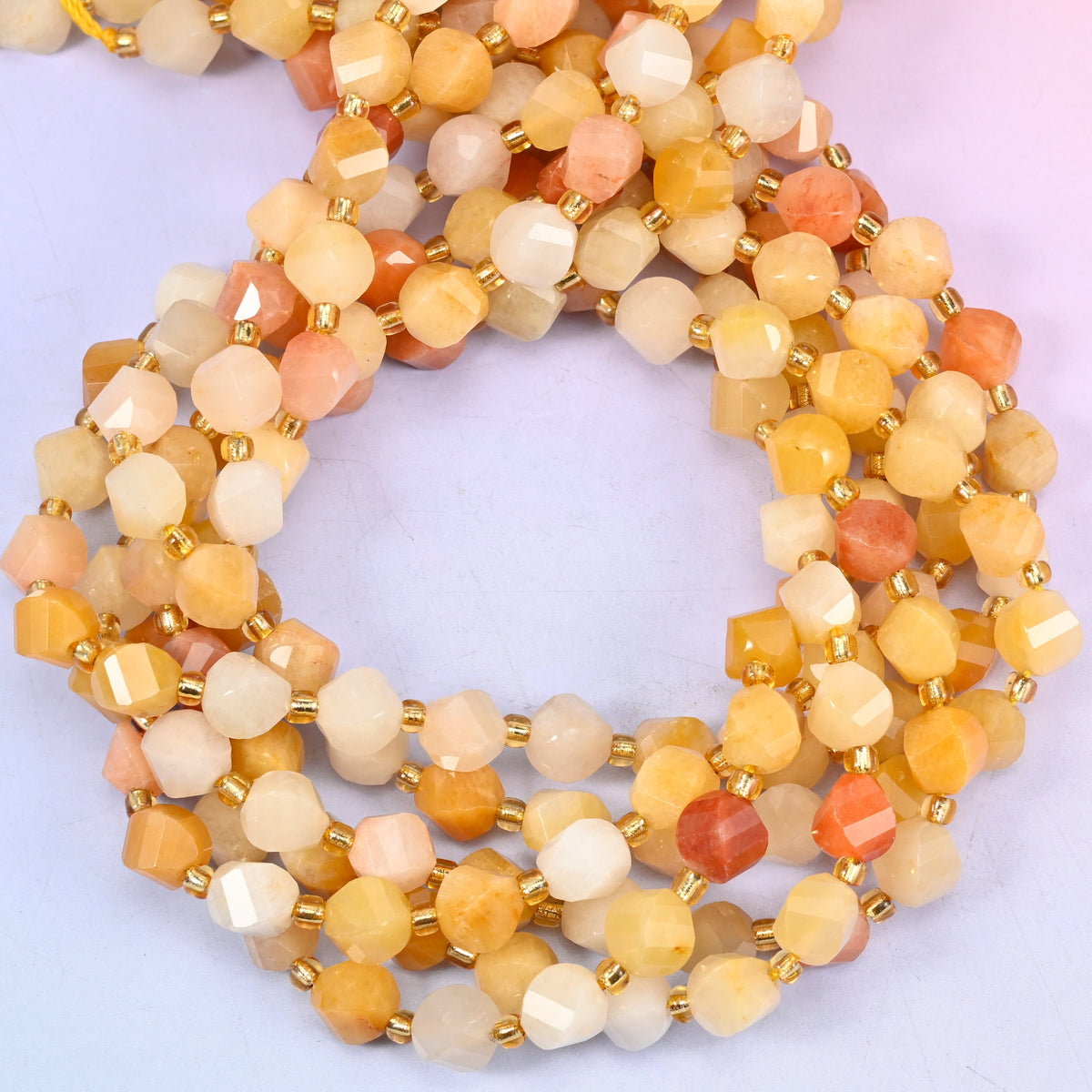 Gold silk jade yellow jade beads, 8mm faceted spiral twist, each bead differing in depth of yellow