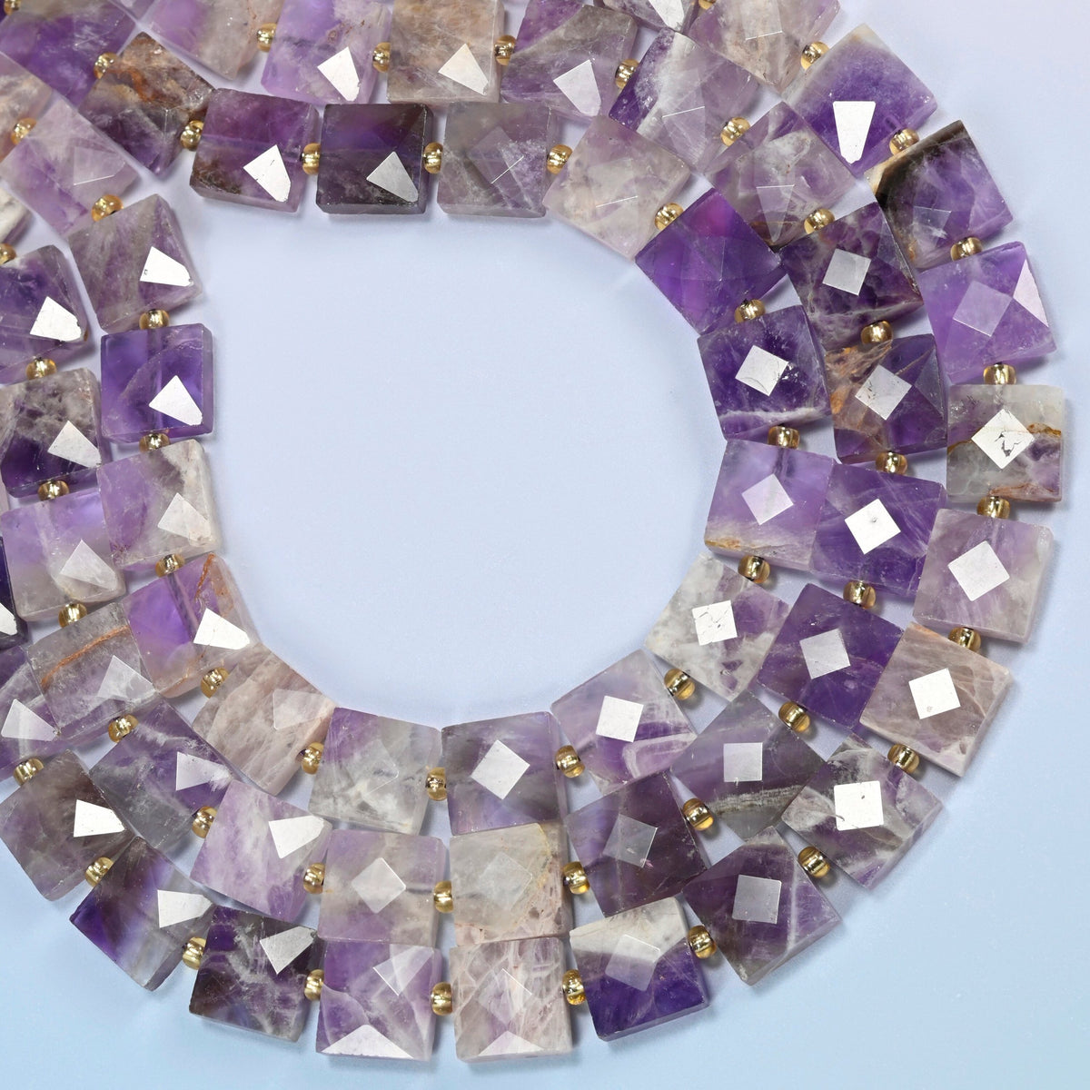 Natural amethyst faceted flat square beads curved into an open loop, deep purple and light lavender beads