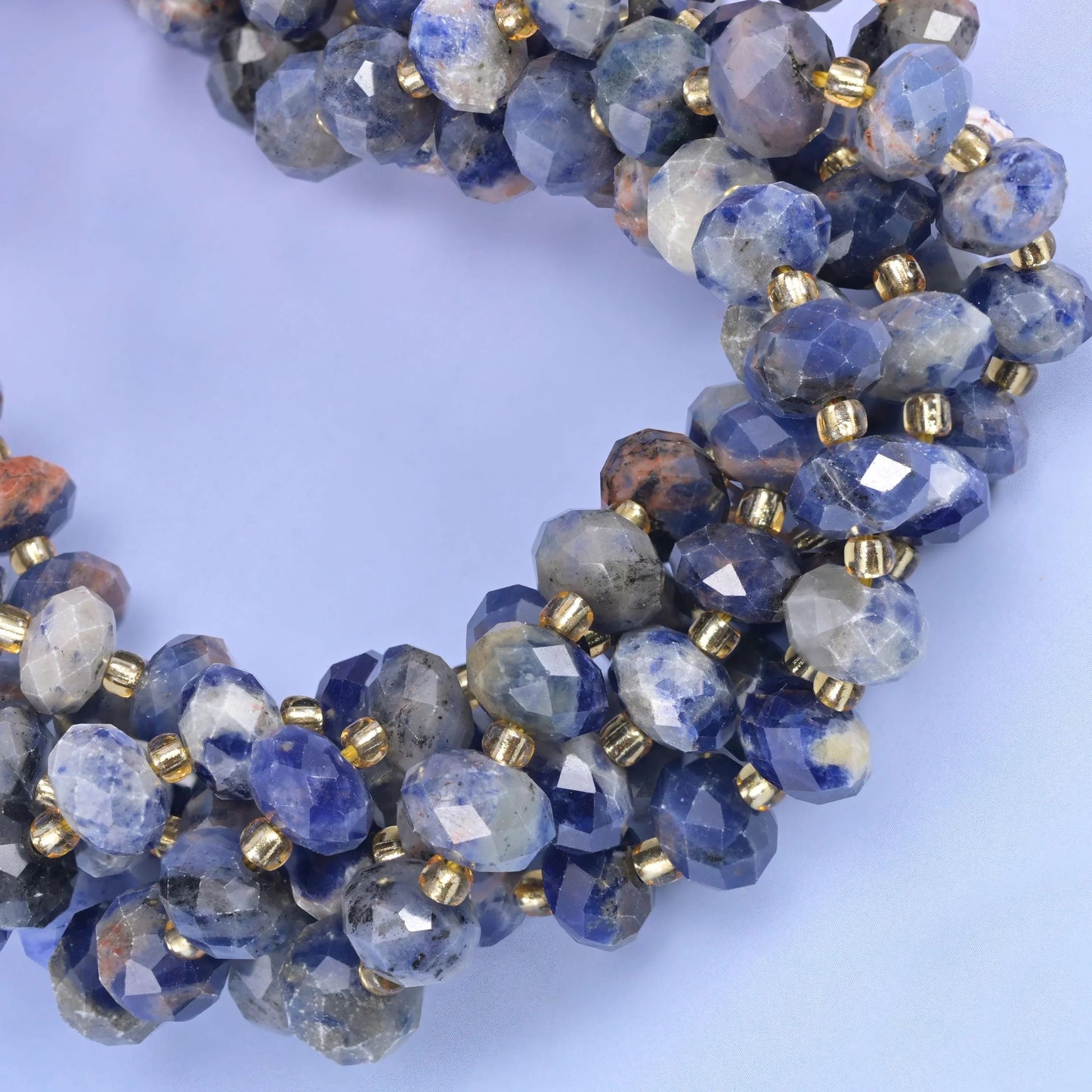 Faceted rondelle cut orange sodalite beads