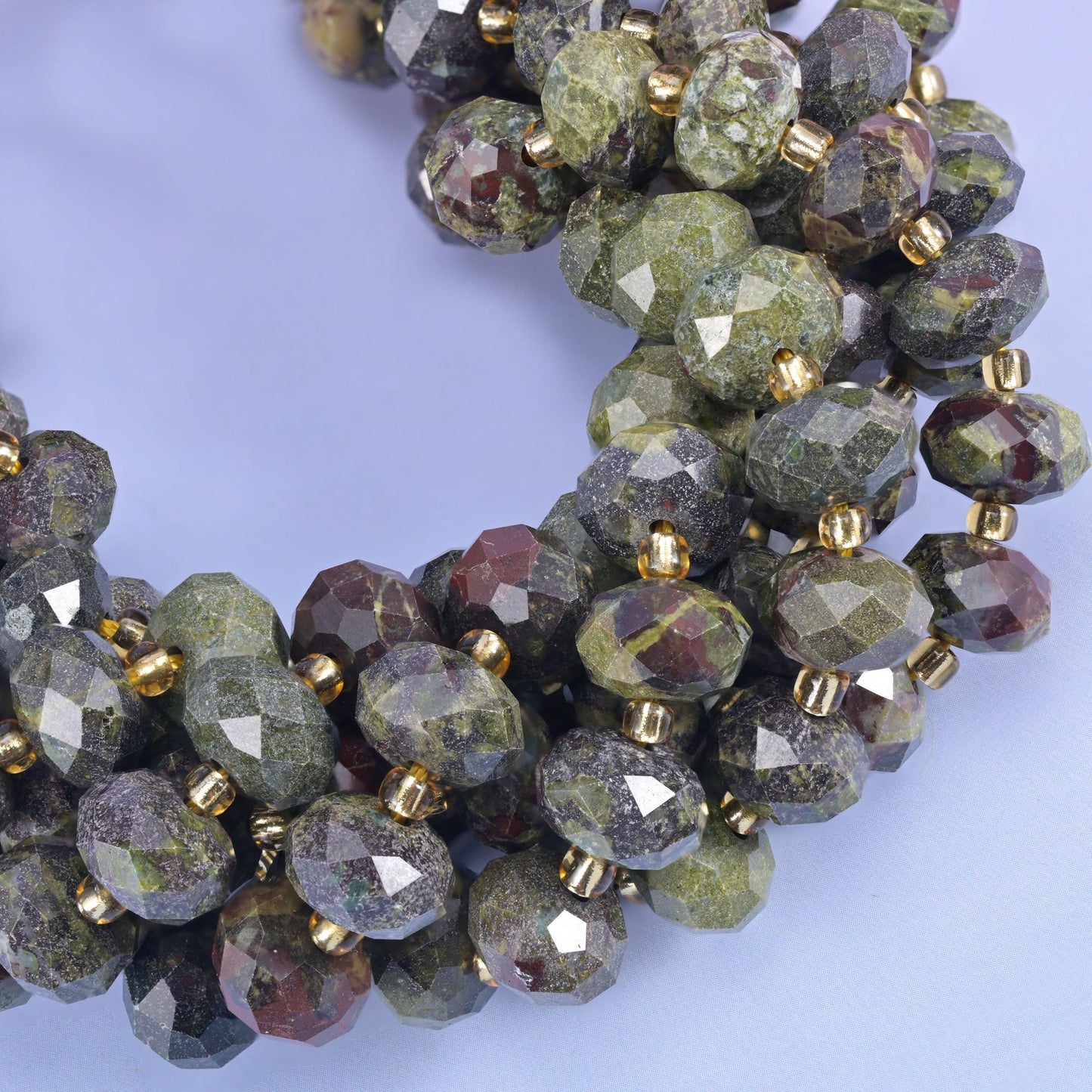 Faceted rondelle cut dragon bloodstone beads