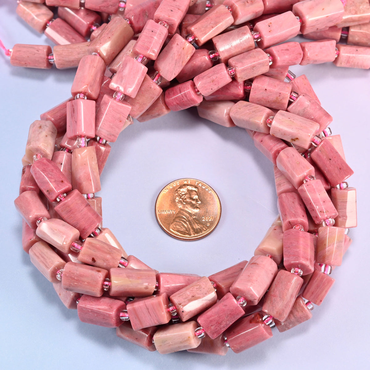 Pink Rhodonite faceted tube beads coiled flat, 9x7mm to 11x7mm natural pink stone tubes on a 15.5 inch strand