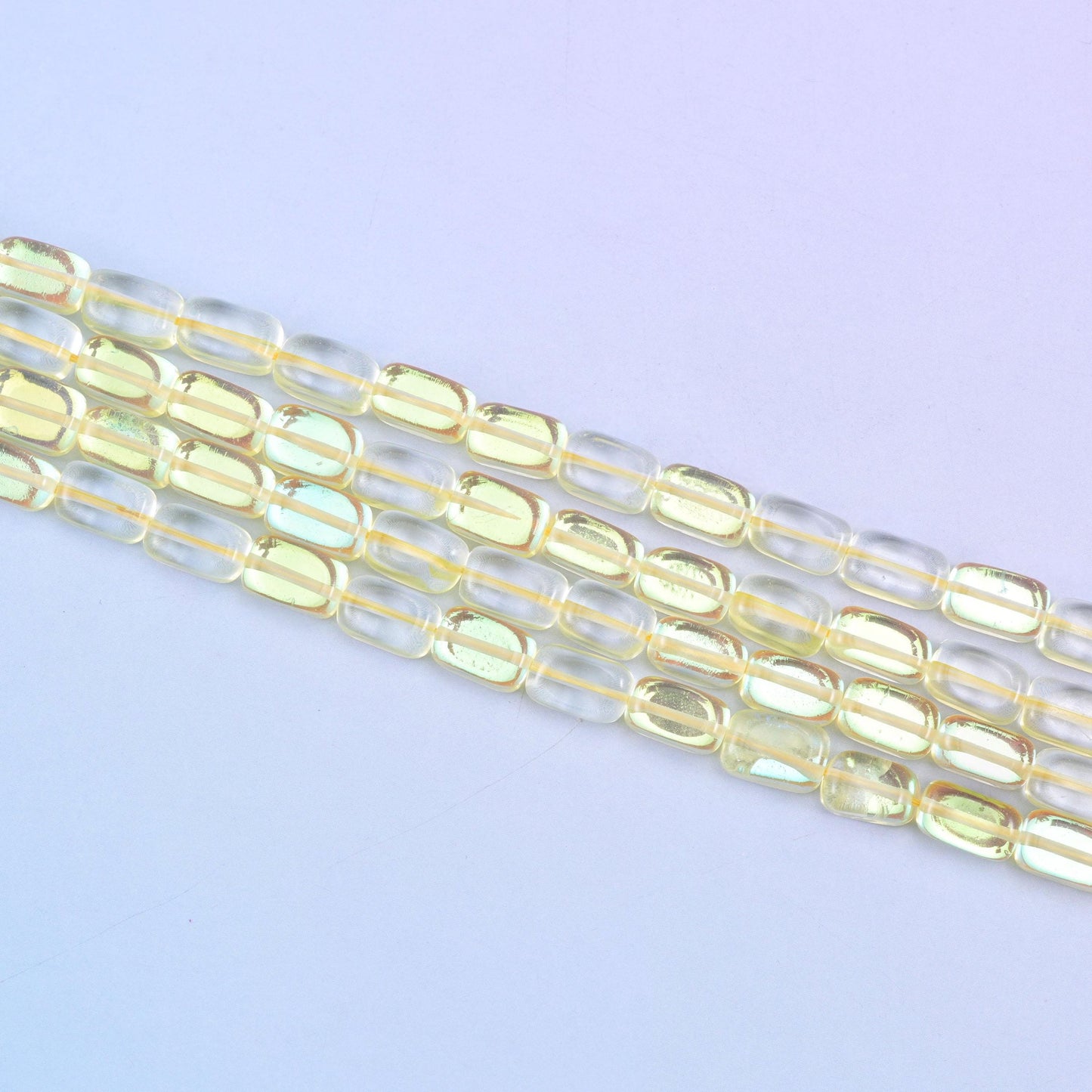 Yellow Mystic Aura glass beads in a sunny golden-yellow shine with a subtle iridescent glow