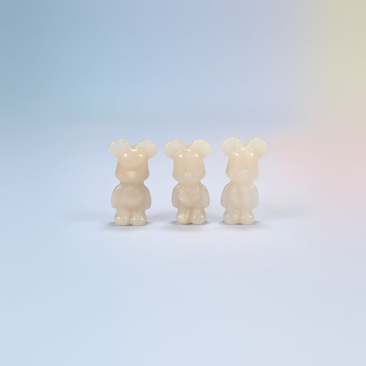 Three 1.5 inch pink aventurine power bear crystal carvings, creamy peach natural stone