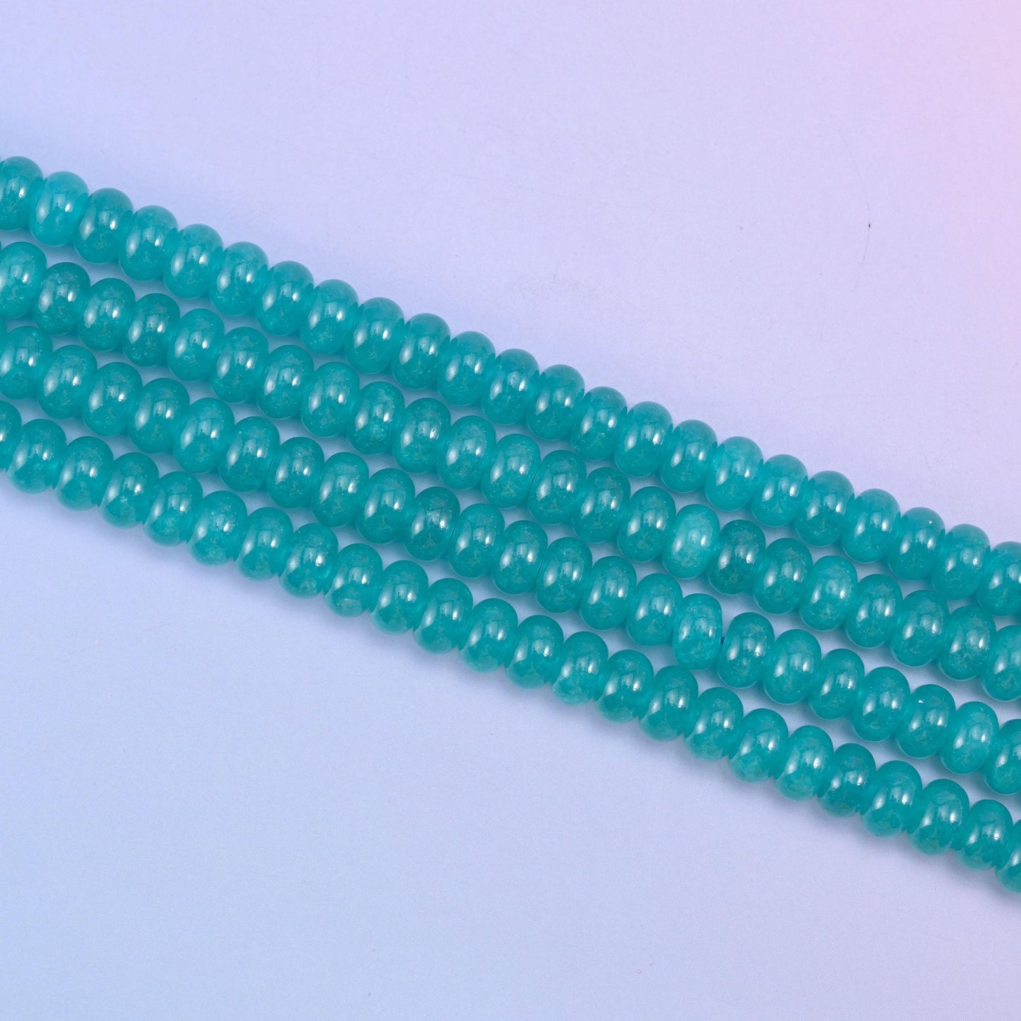 Teal Dyed Jade beads in a rich aqua-teal tone