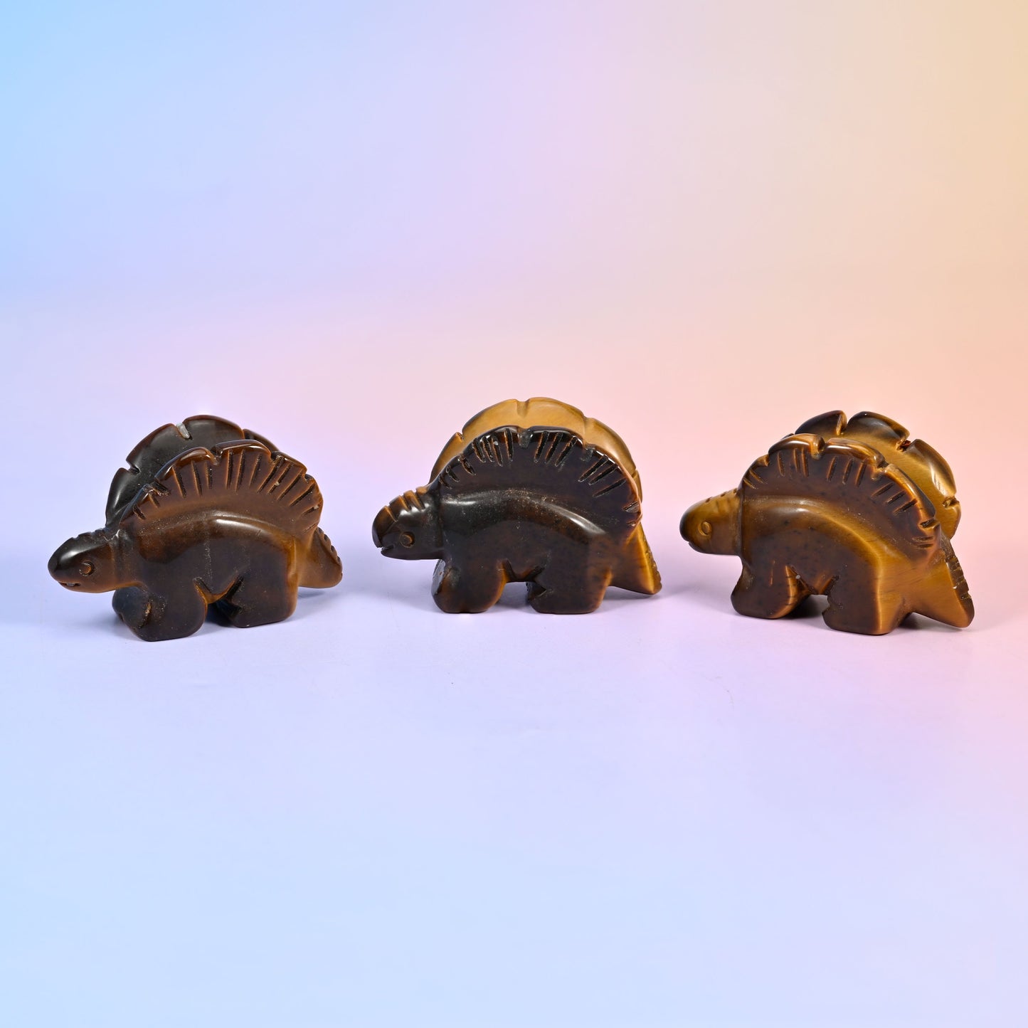 Carved stone stegosaurus figurine, polished to a high shine, about 1.4 oz, sold per piece