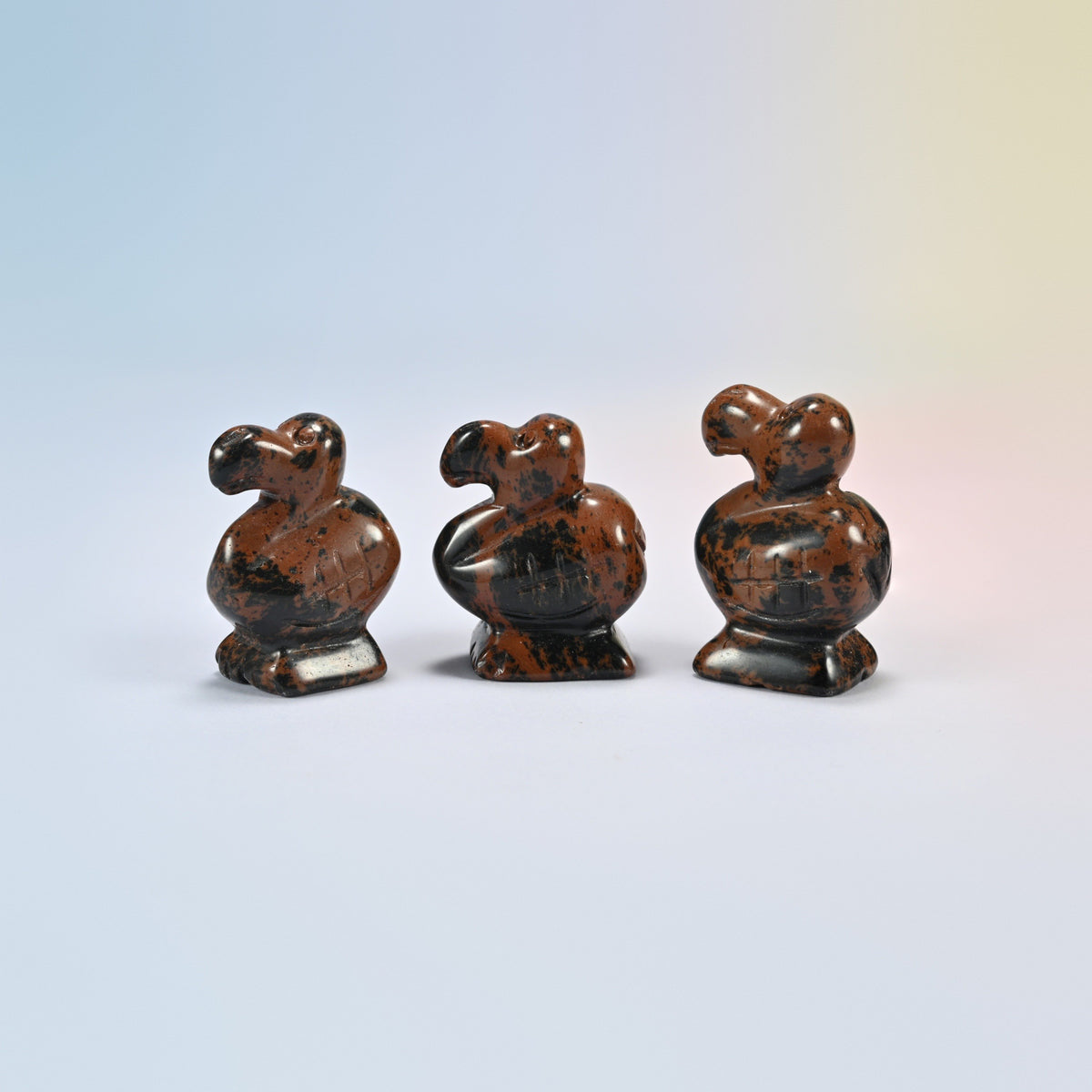 Three golden swan dodo bird crystal carvings, 1.5 inch, black and red-brown natural stone