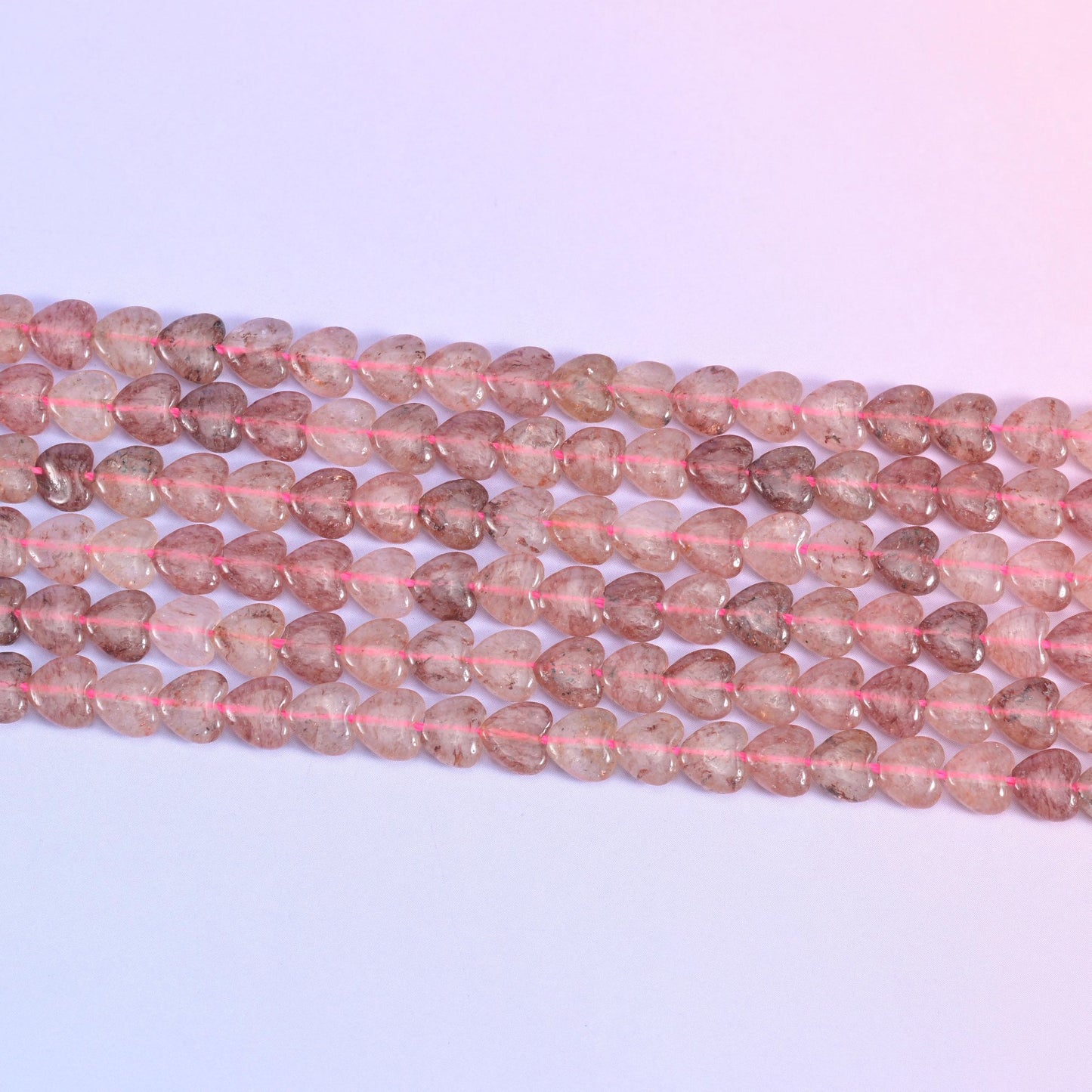 Strawberry Quartz Heart Beads in dusty rose with rust-red inclusions