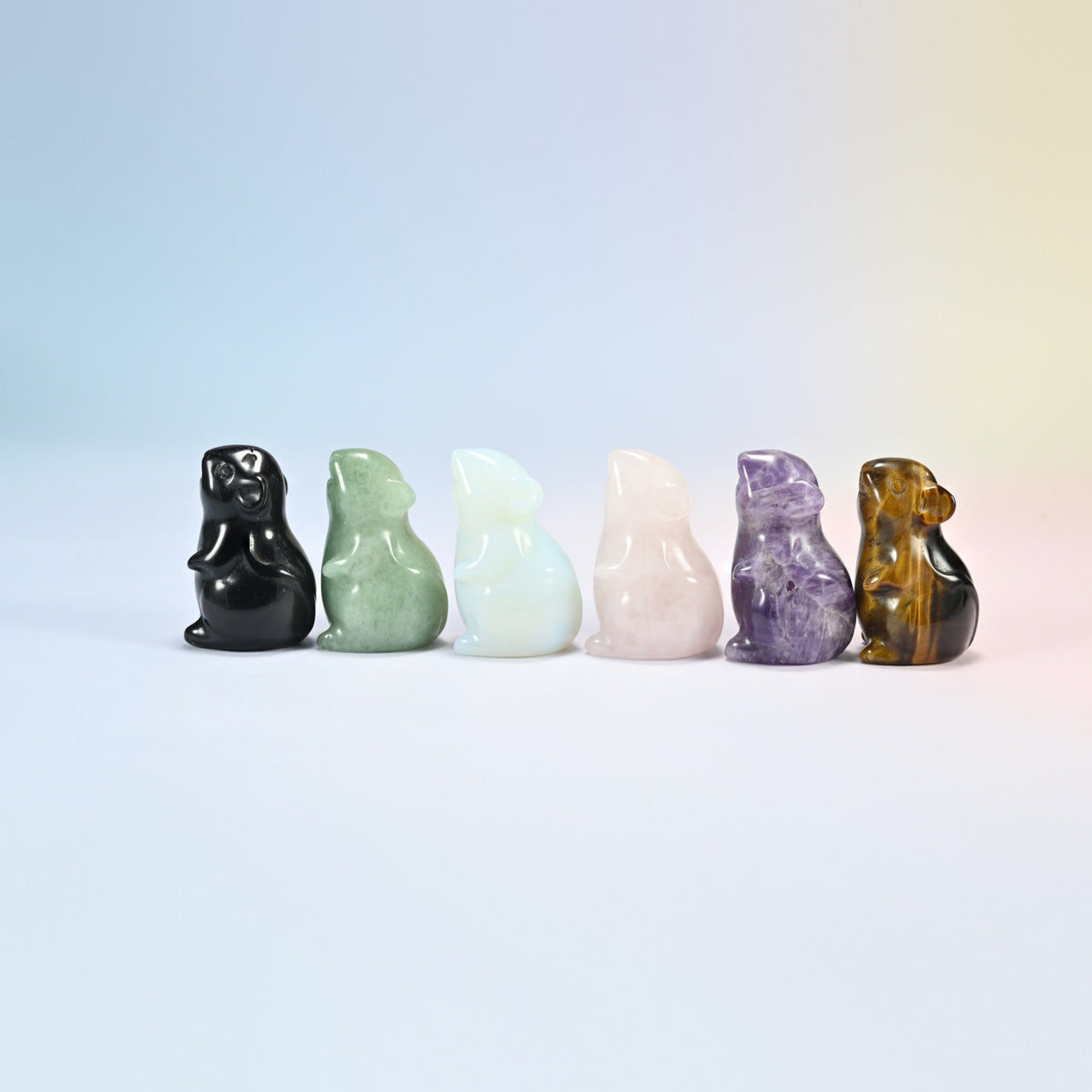 Six small crystal mice turned to the side showing the round ears