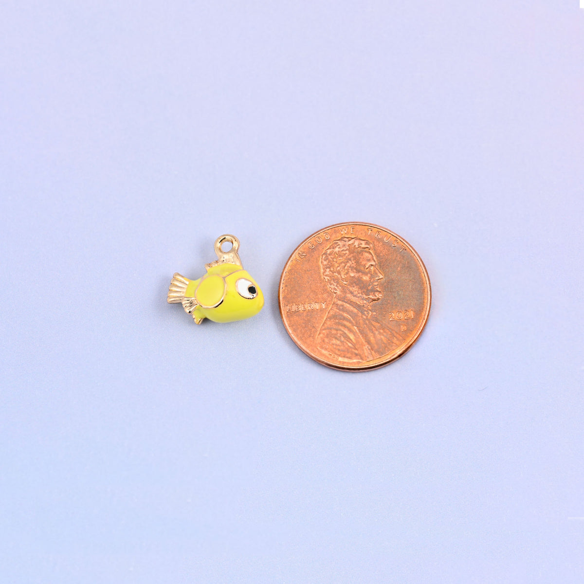 Fish charm at actual size, 12.27 x 11.58mm across and 6.79mm thick.