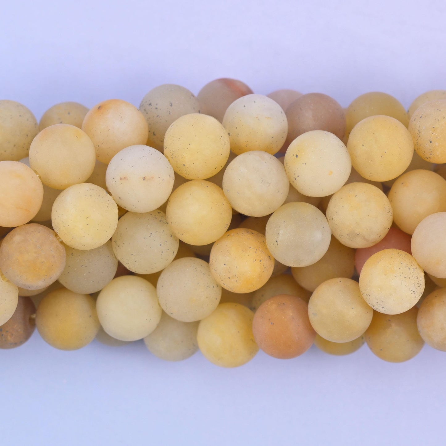 Matte round cut yellow jade beads