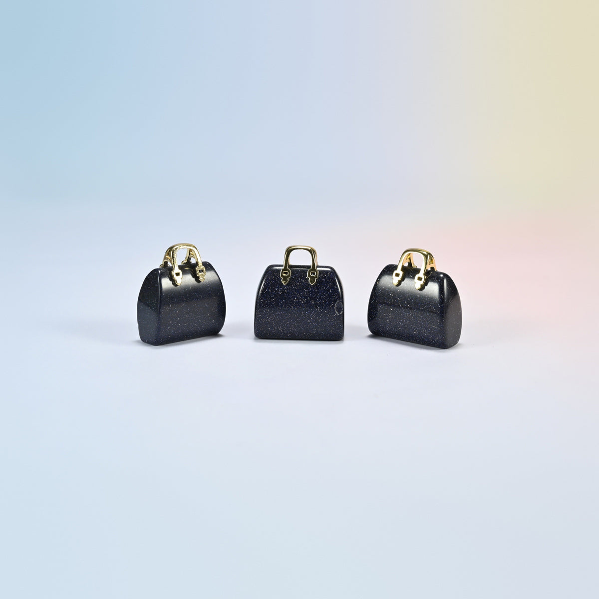 Three blue sandstone purse crystal carvings, 1 inch, dark blue man-made glass with sparkle, gold-tone handle