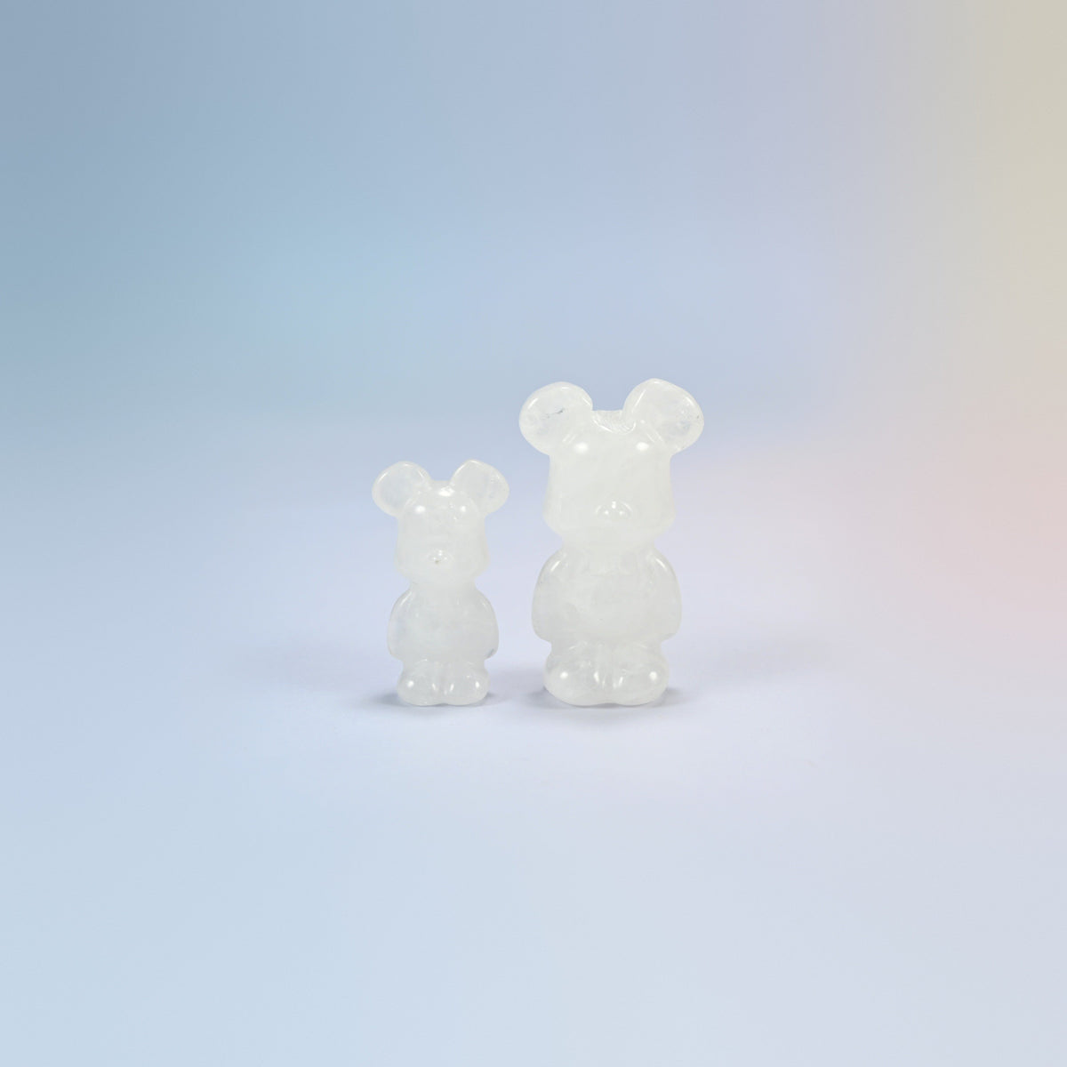 A 1.5 inch and a 2 inch clear quartz power bear crystal carving, milky clear natural stone