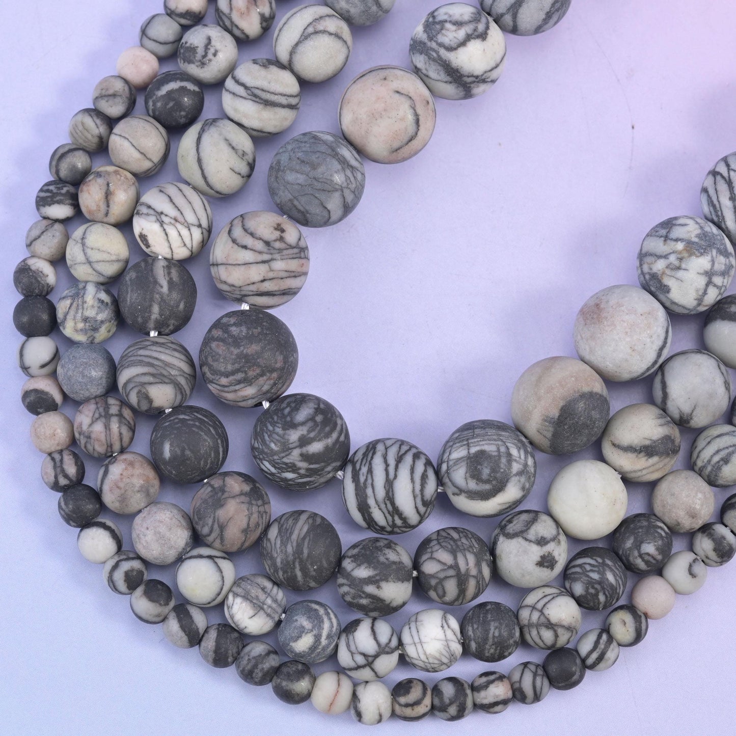 Matte round cut black web jasper beads