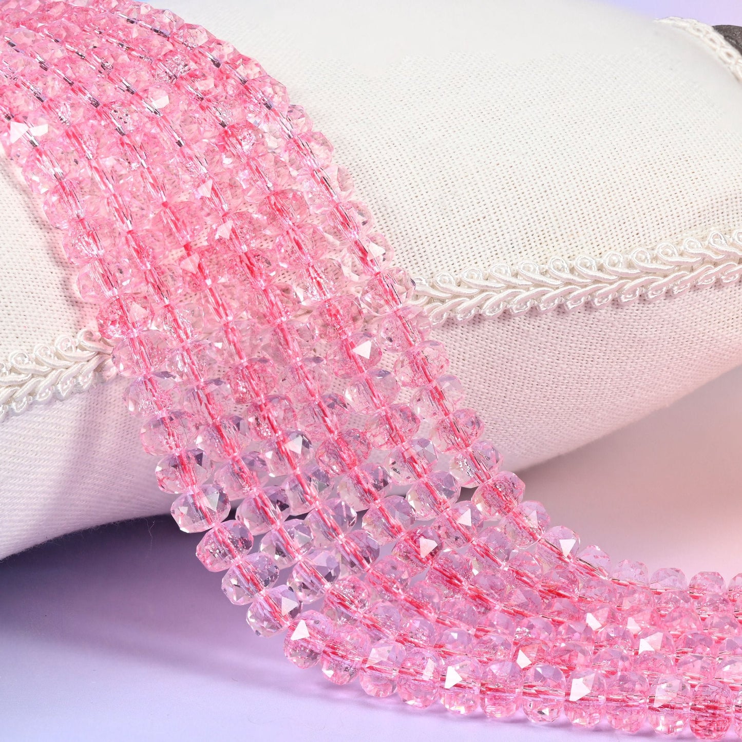 Transparent pink faceted rondelle glass beads, clear rose-pink with crisply cut facets