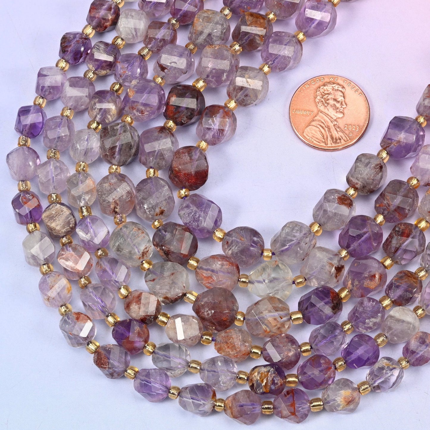 Faceted spiral twist cut natural Super 7 Phantom quartz beads
